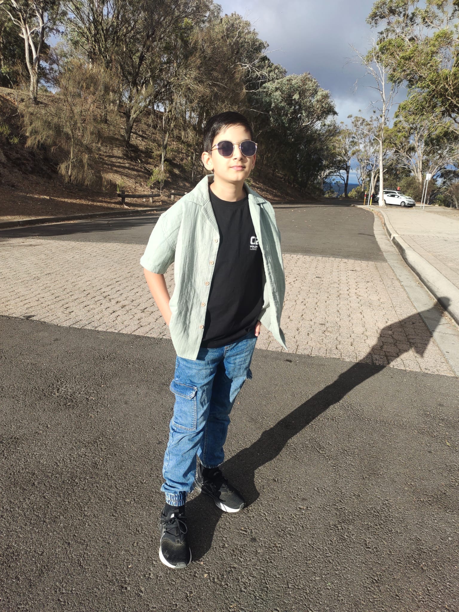 Arman standing outdoors